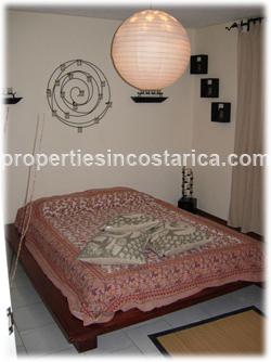 Alajuela condo, Alajuela real estate, Costa Rica condominium, parking, swimming pool, granite countertops, for sale, two bedroom, internet, Cable TV, new highway, 24/7 security, maintenance, gardens, 1079