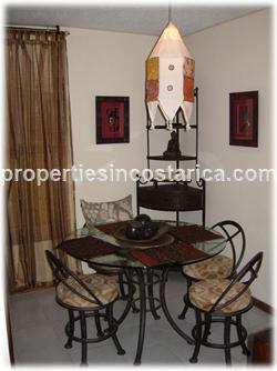 Alajuela condo, Alajuela real estate, Costa Rica condominium, parking, swimming pool, granite countertops, for sale, two bedroom, internet, Cable TV, new highway, 24/7 security, maintenance, gardens, 1079